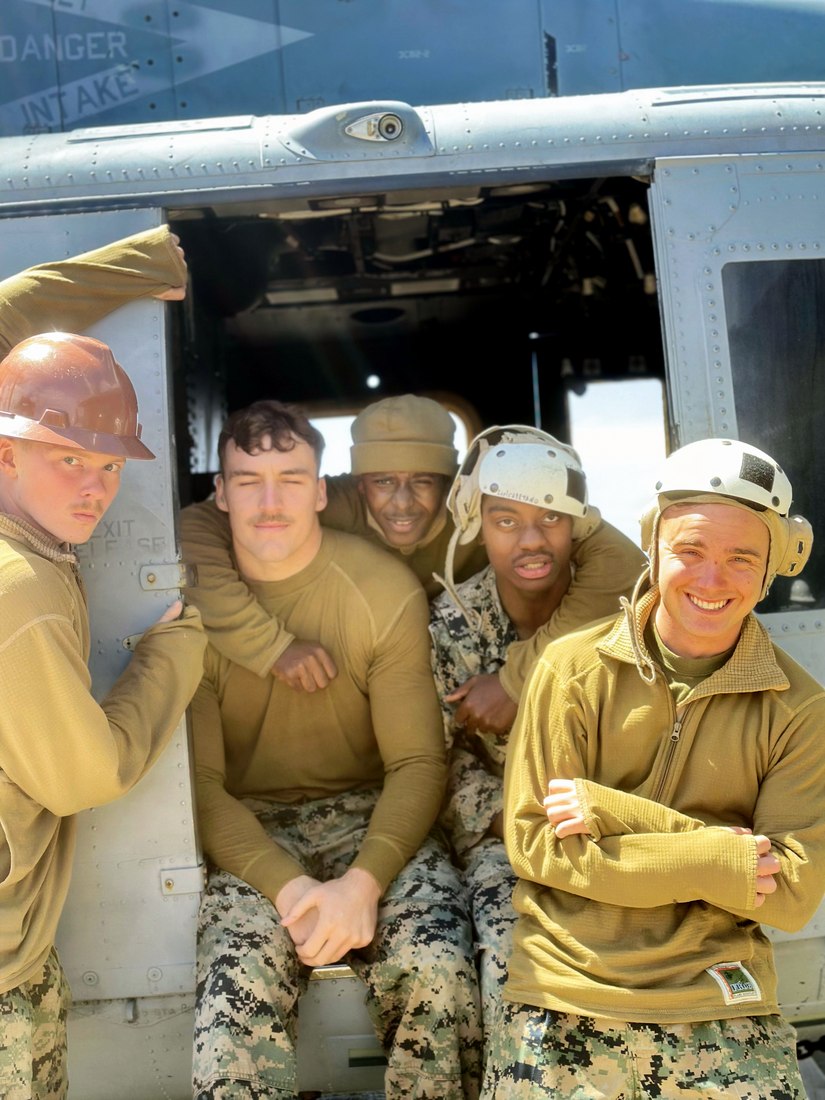Jerry and his unit in a UH-1Y Venom helicopter on a Navy aircraft carrier near Palau